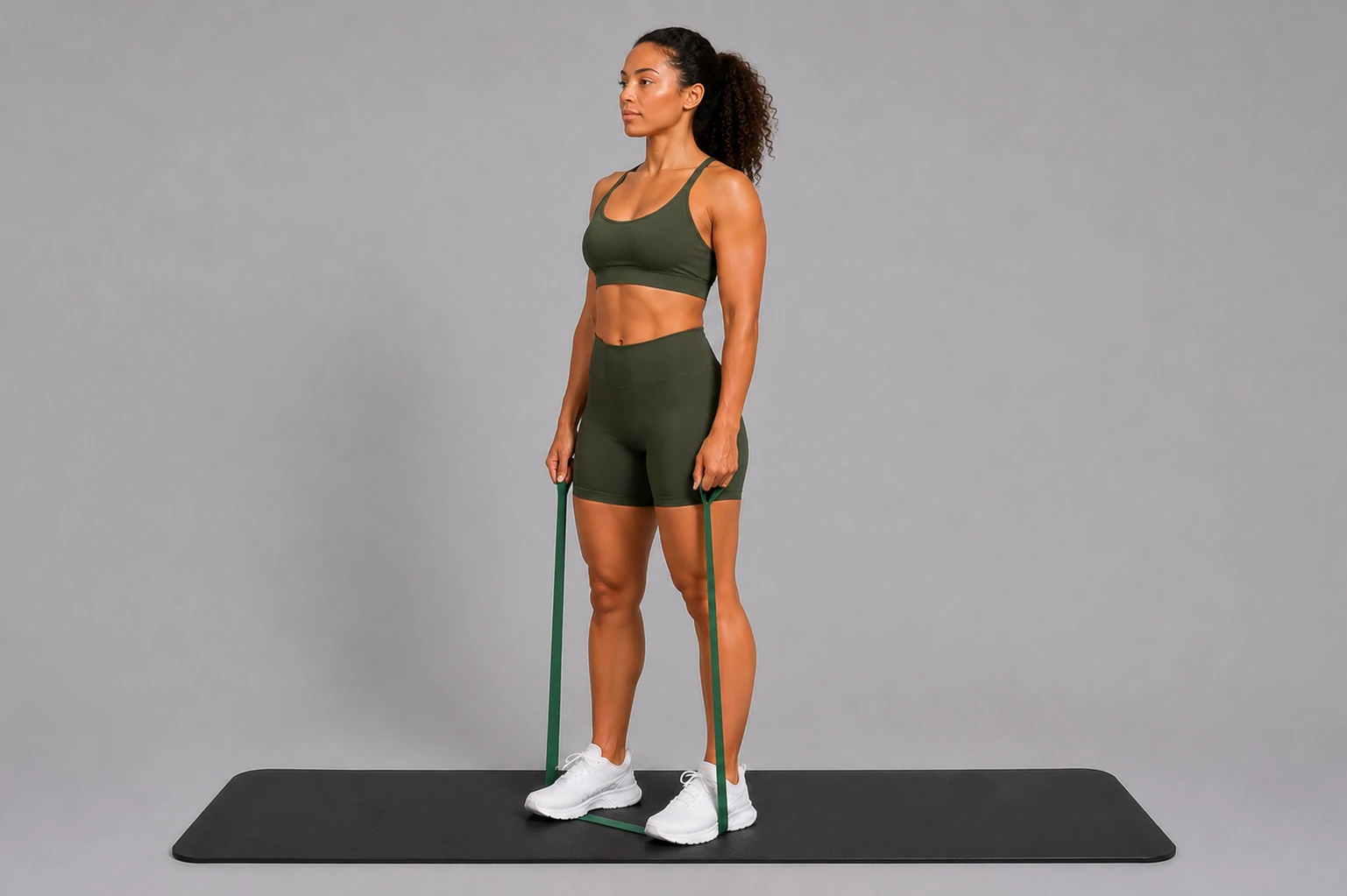 Band lateral raise start position with arms at the sides