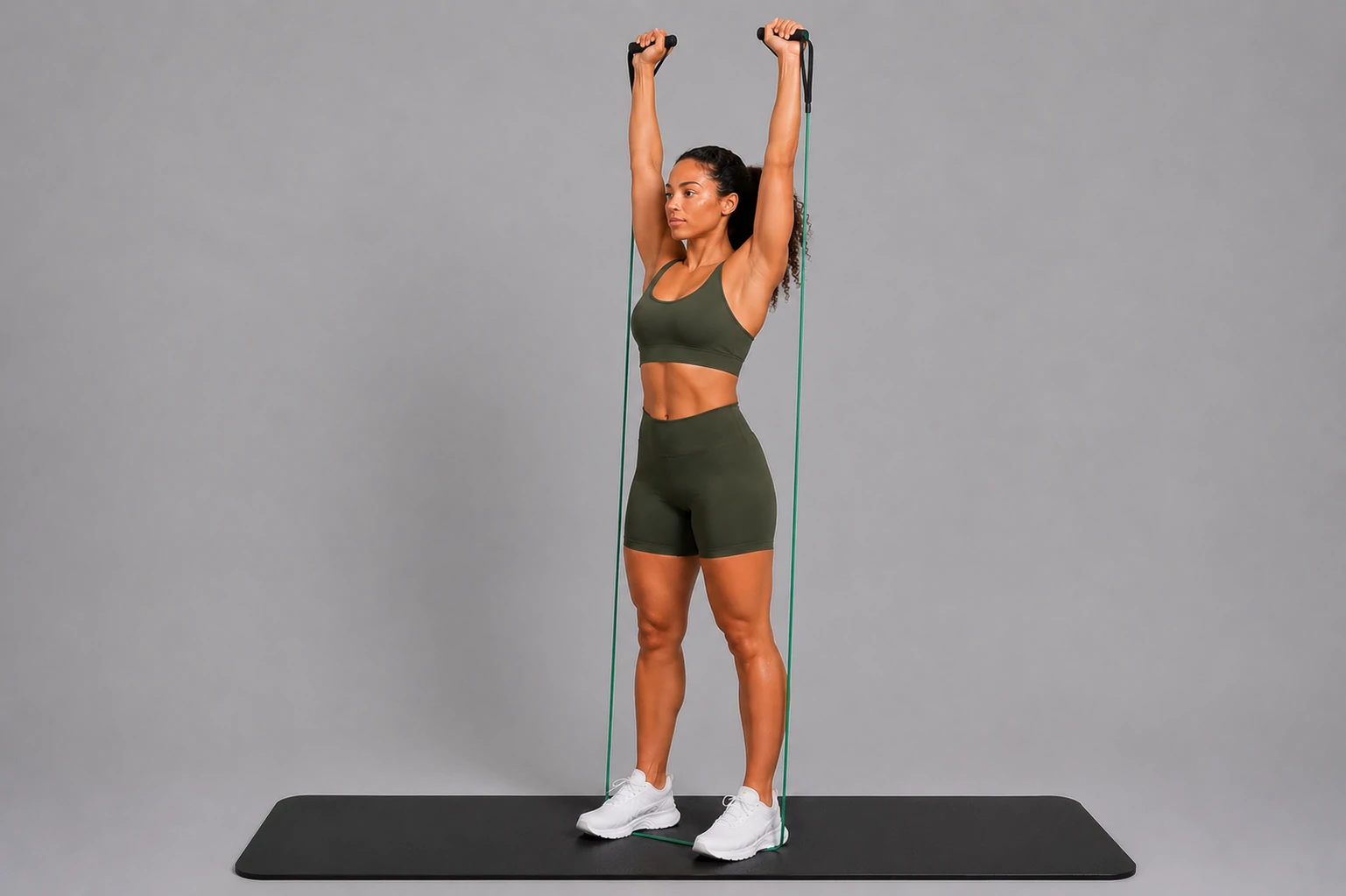 Band shoulder press end position with arms pressed overhead